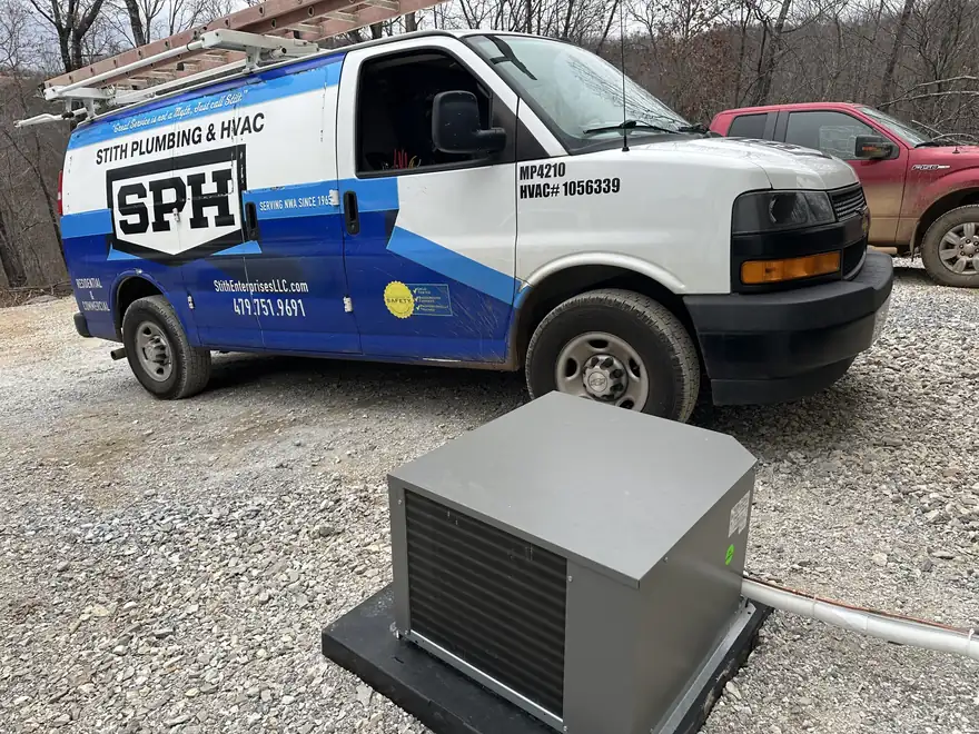 A Stith Plumbing & HVAC van, lettered Serving NWA since 1965 with its licence numbers, parked behind a newly installed condensing unit